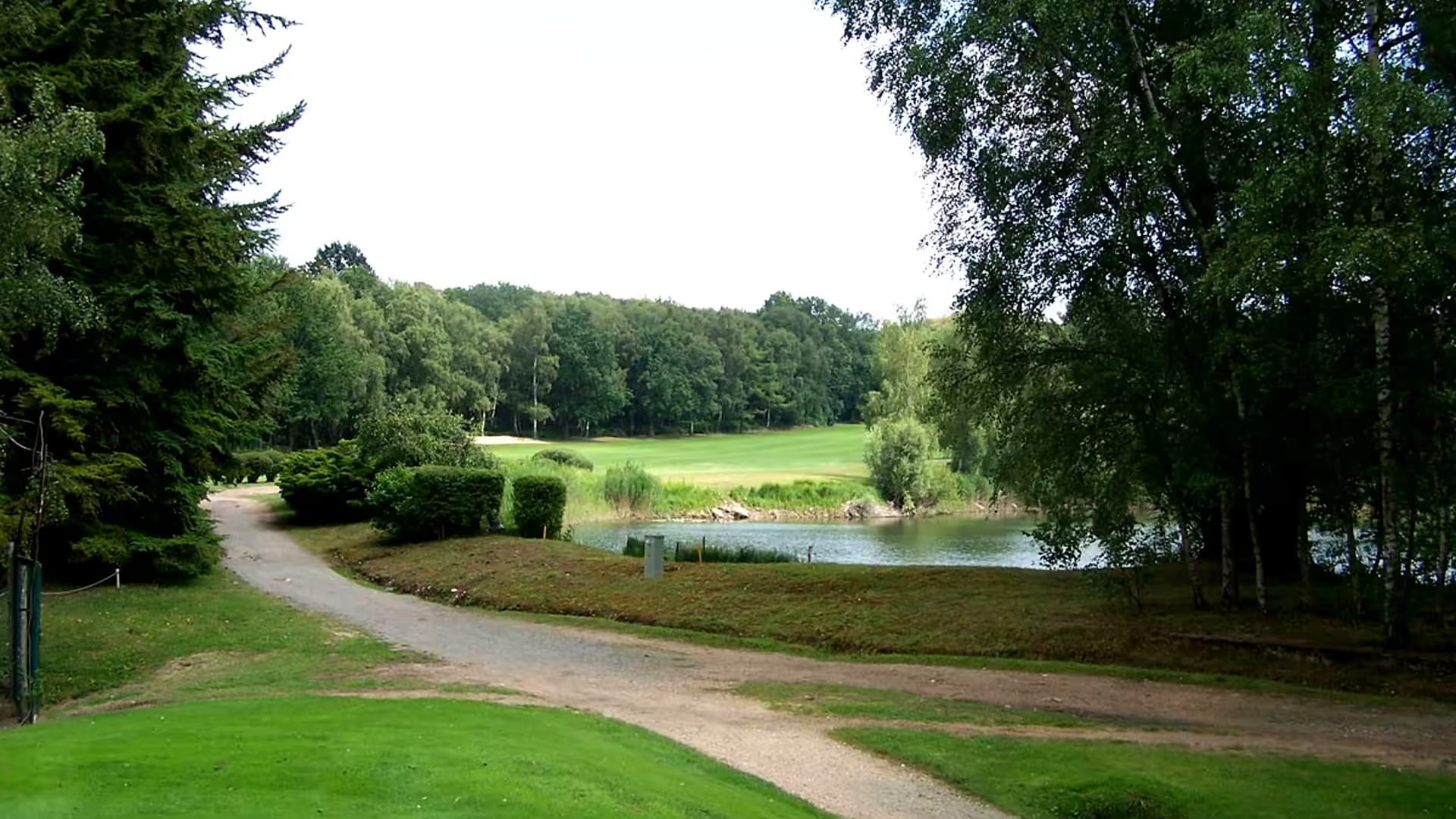 A golfer on the fairways of les chataigniers course at golf de domont montmorency, surrounded by the stunning landscape of ile de france, france