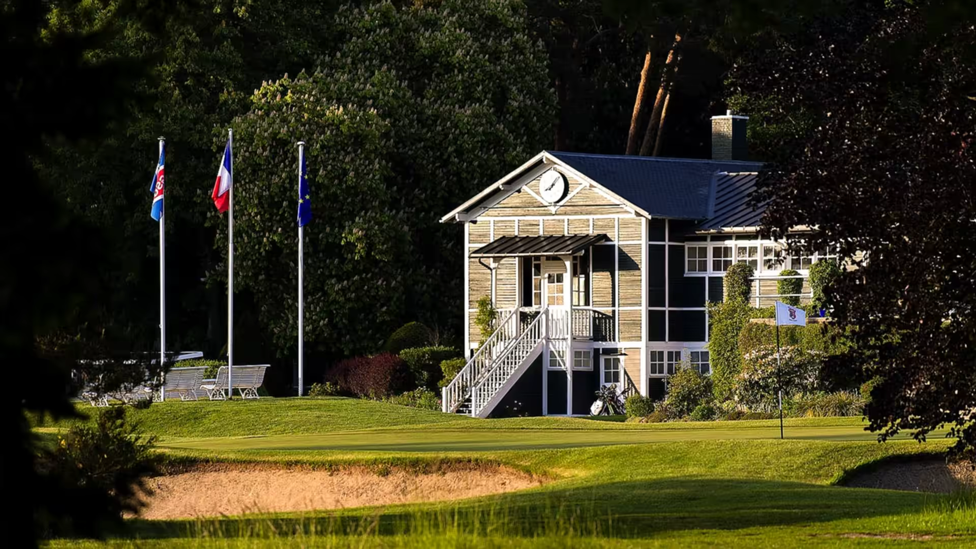 A golfer on the fairways of grand parcours course at golf de saint germain, surrounded by the stunning landscape of ile de france, france